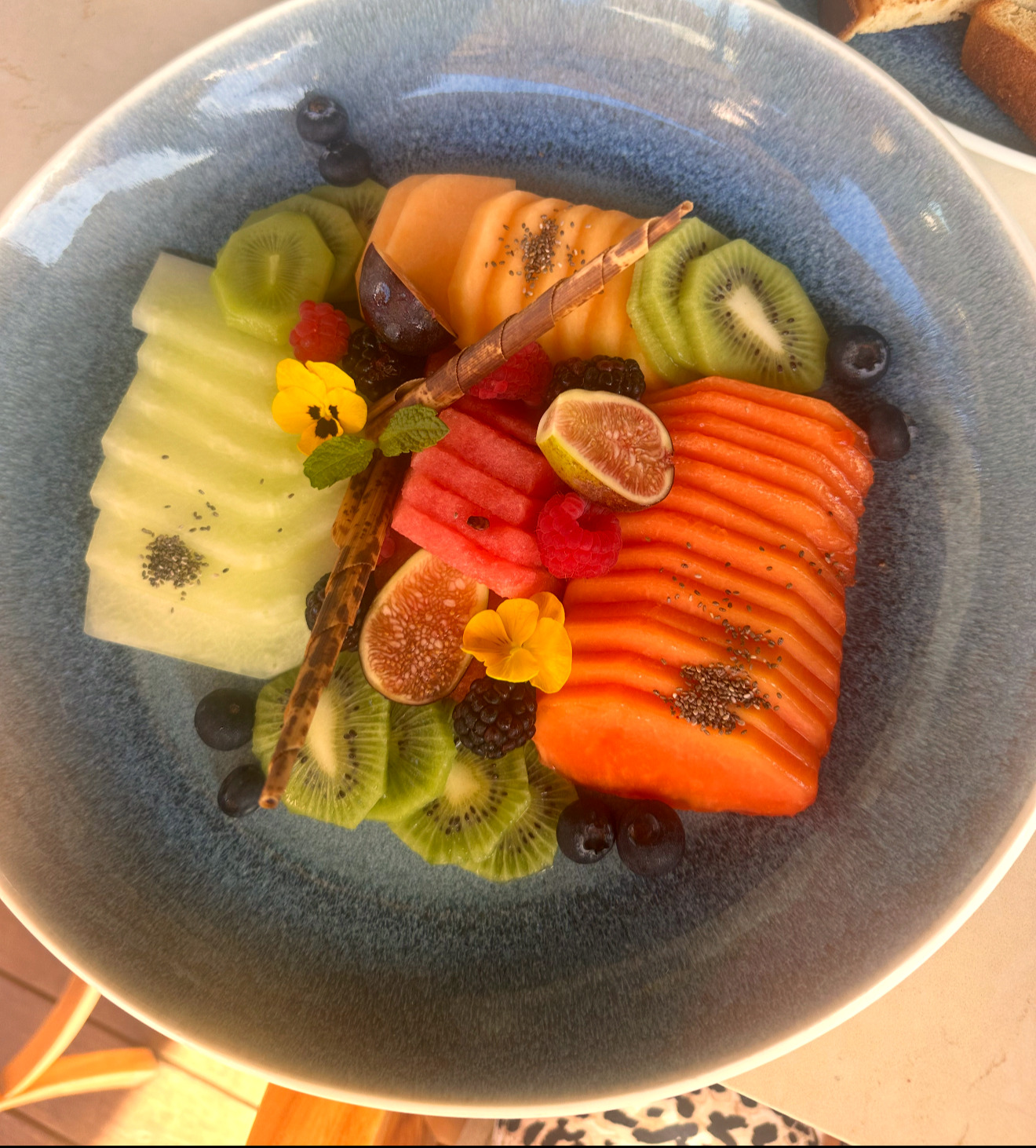 Artisan fruit plate with edible flowers