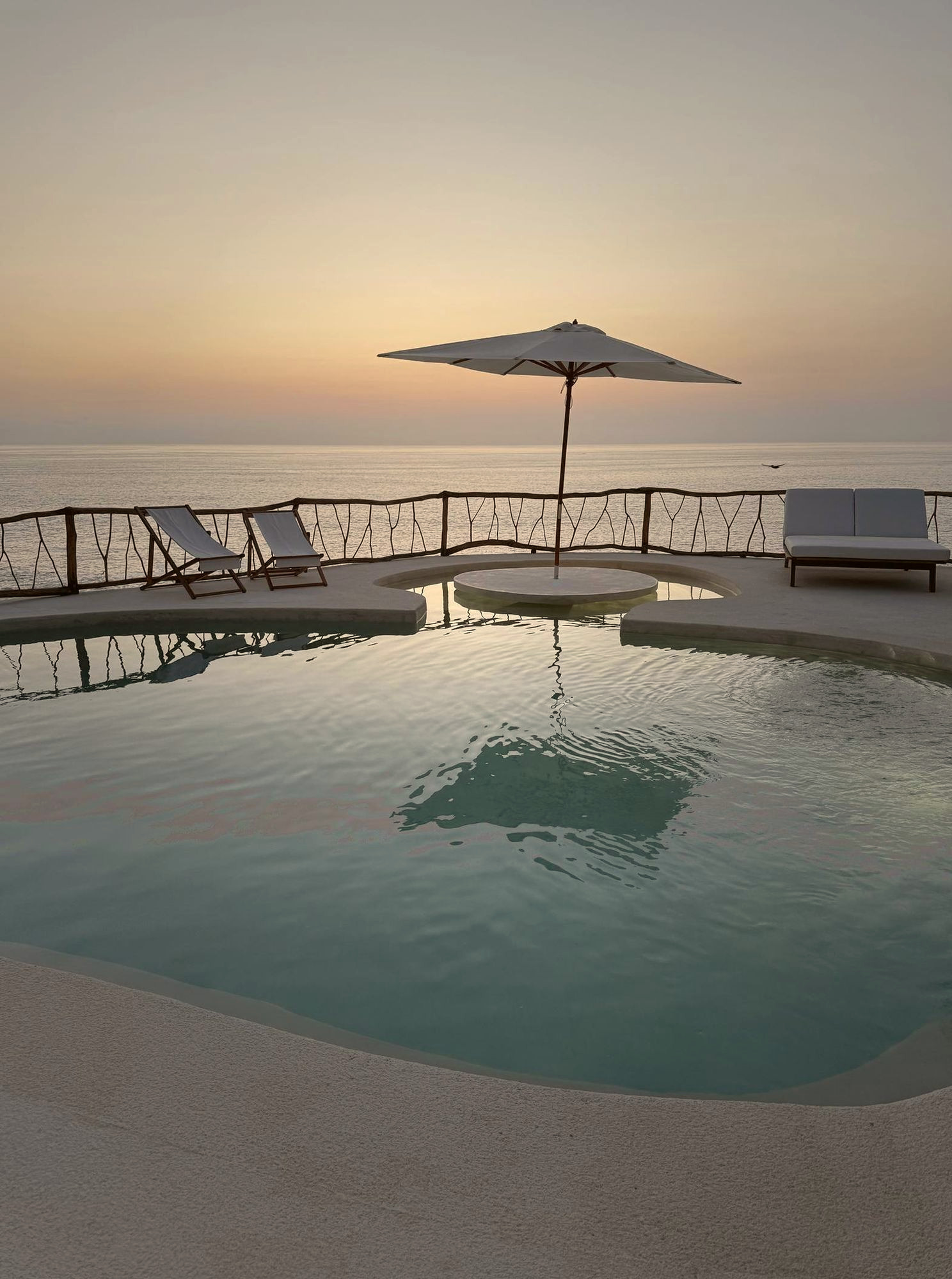 ZAIA saltwater pool at dusk