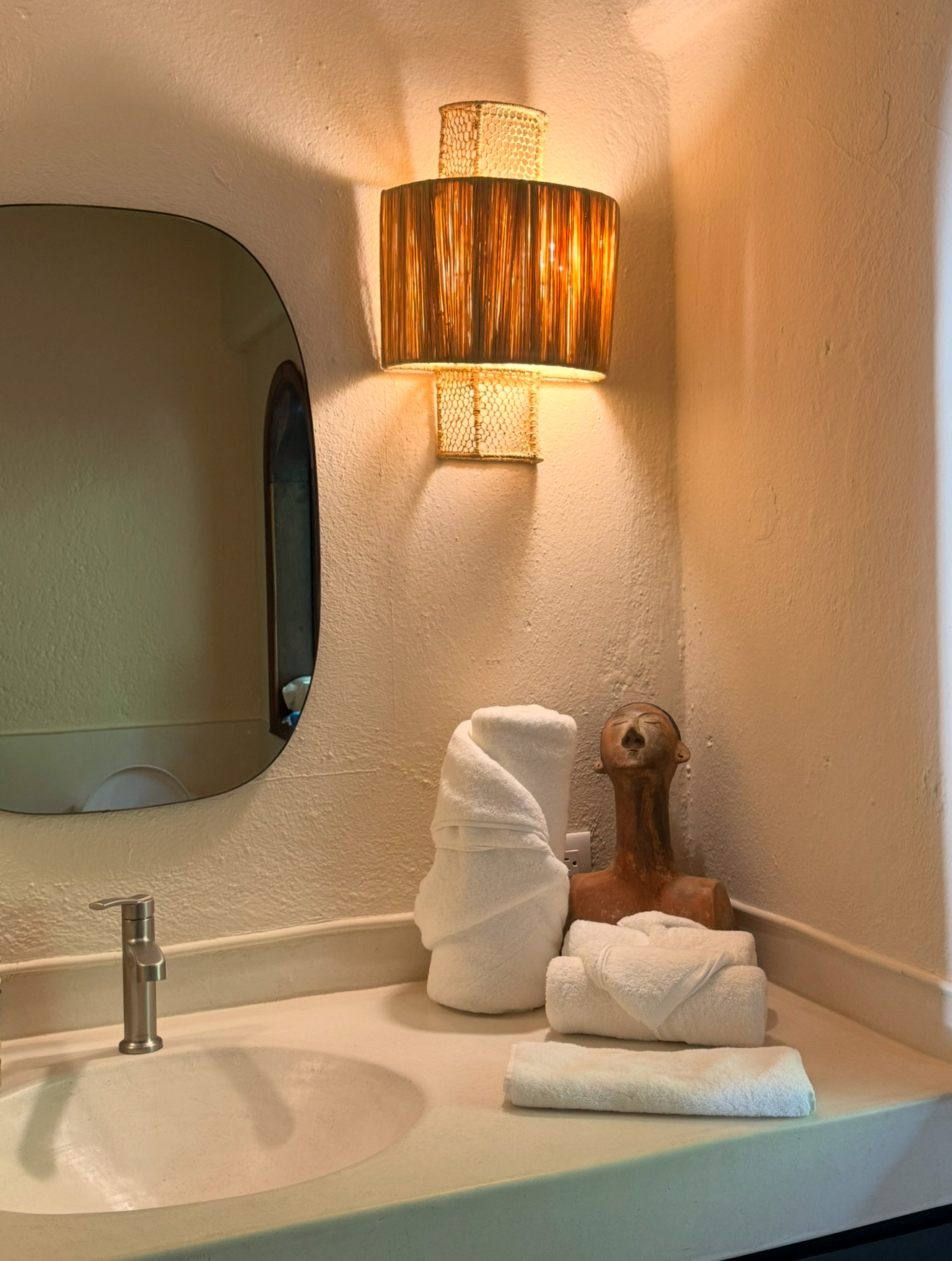 Bathroom with woven sconce